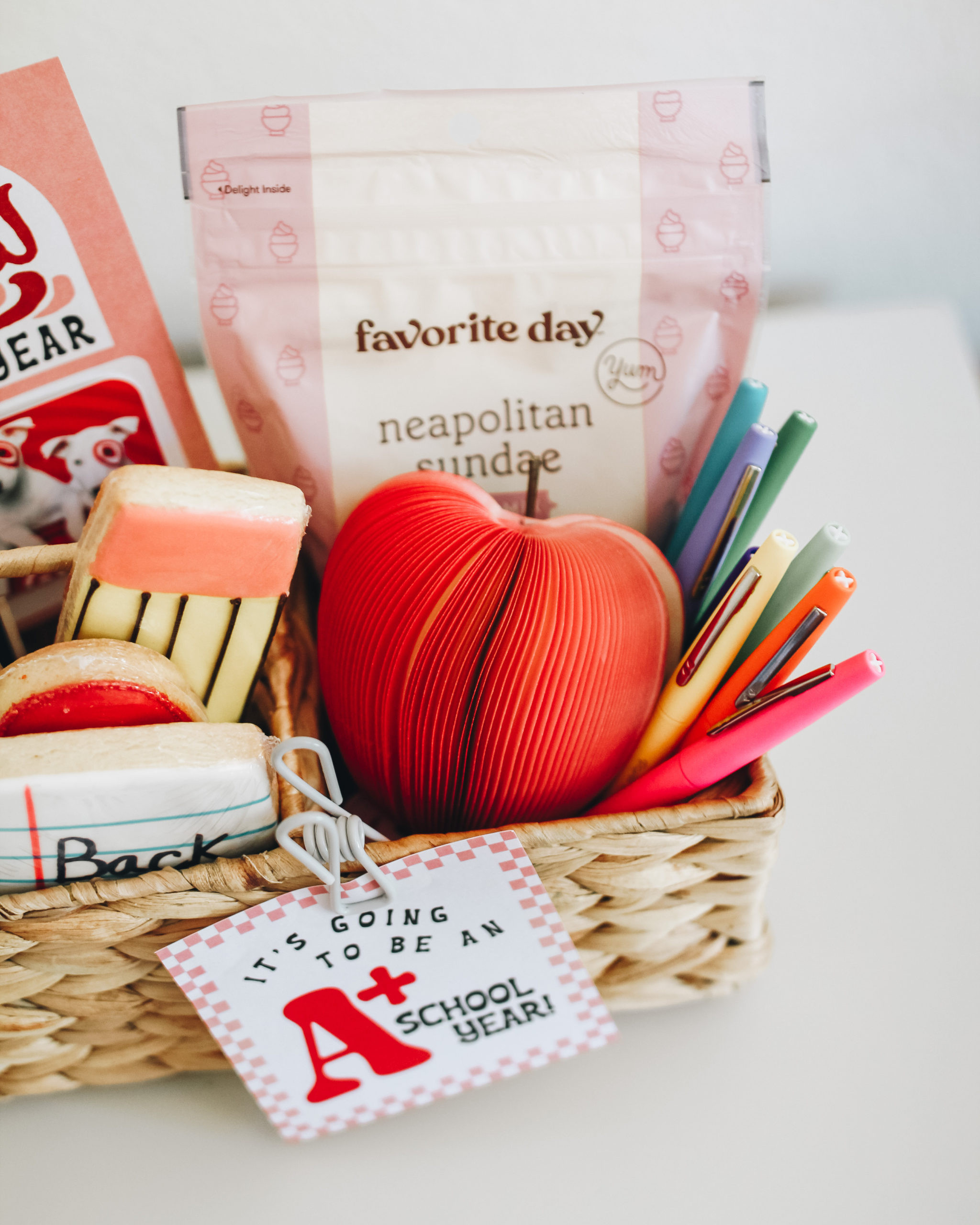 Alt: A teacher appreciation gift basket filled with colorful items like stationery, snacks, and a personalized mug.