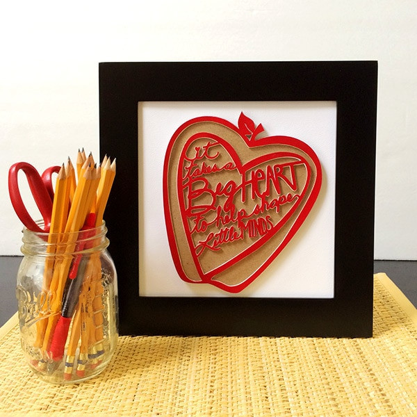 alt text: A colorful gift tag decorated with paint splatters and a handwritten thank you message.