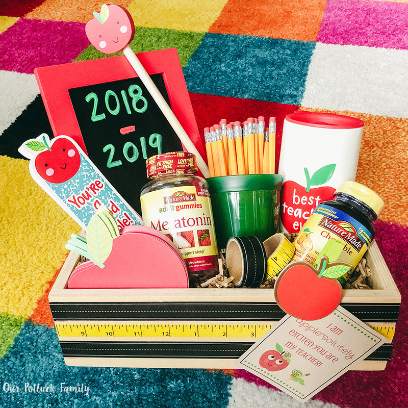 alt text: A personalized tote bag for a teacher, filled with school supplies and a personalized mug.