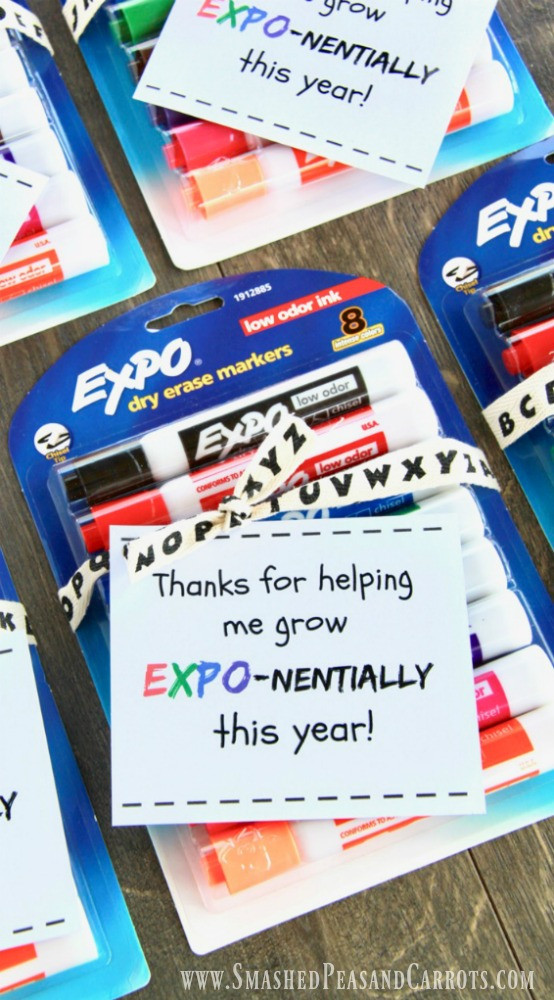 alt text: Colorful dry erase markers arranged on a table, ready to be gifted to a teacher.