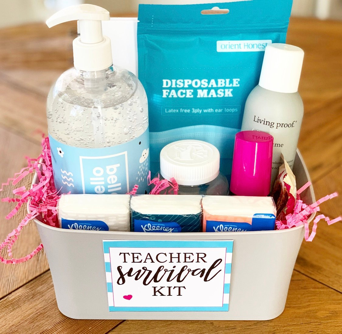 alt text describing a teacher survival kit with various supplies, presented in a decorative container