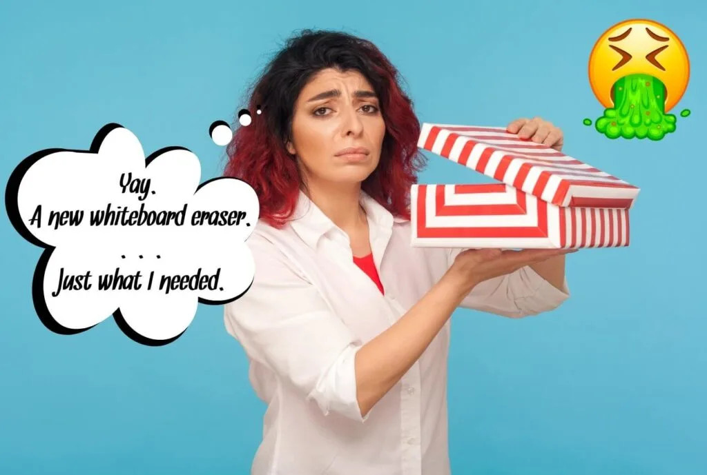 alt=A teacher looks disappointed while opening a gift of classroom supplies. Many teachers prefer gifts unrelated to their profession.